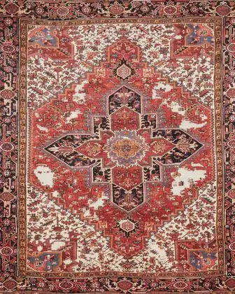 Tapis Heriz 1930 avant restauration — multiples zones dévorées par les mites